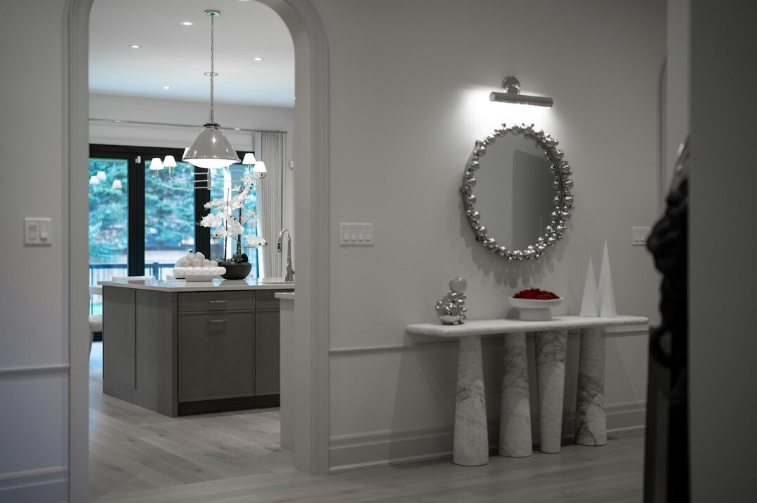 Vintage decorative objects and lighting on a marble console table